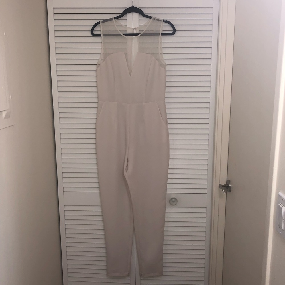 White jumpsuit with mesh accents